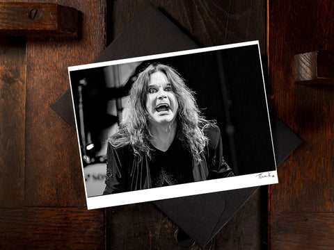 Greeting card black and white print of Ozzy Osbourne of Black Sabbath performing at Download Festival in 2012. Features a close-up of Ozzy on stage. By Tina K Photography.