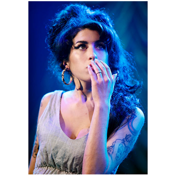 Amy Winehouse looking thoughtful on stage at Shepherds Bush Empire on the Back to Black tour 2007. Original photo print signed by Tina K. Photography.