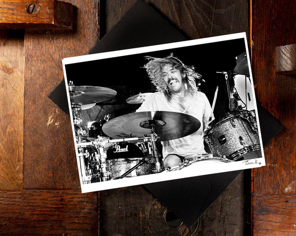 Greeting card of Taylor Hawkins playing drums onstage at Download festival 2010 with Taylor Hawkins And The Coattail Riders. A6 black and white print by Tina K Photography
