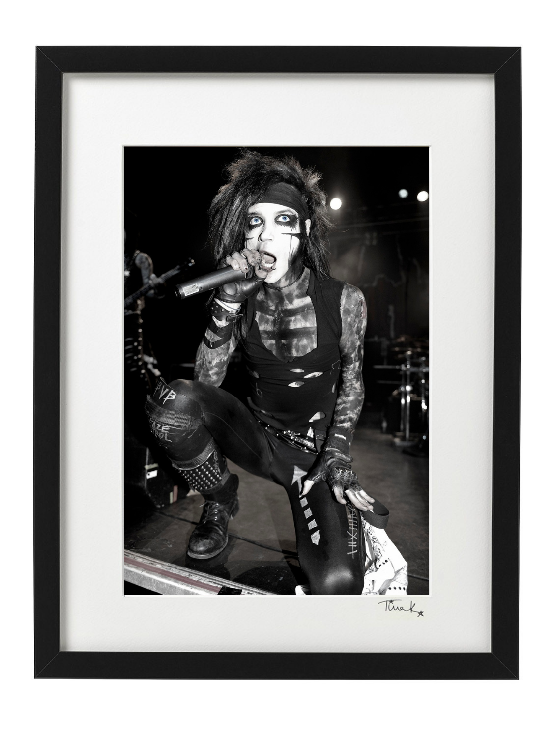 Andy Biersack of Black Veil Brides kneeling on stage with black makeup at the Forum in London 2011. Black and white framed print signed by Tina K Photography.