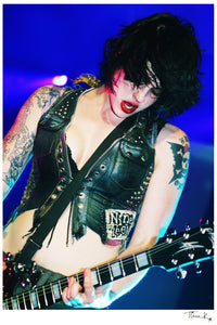 Brody Dalle of punk rock band The Distillers playing guitar onstage at the NME Awards 2004. Print signed by Tina K Photography. 