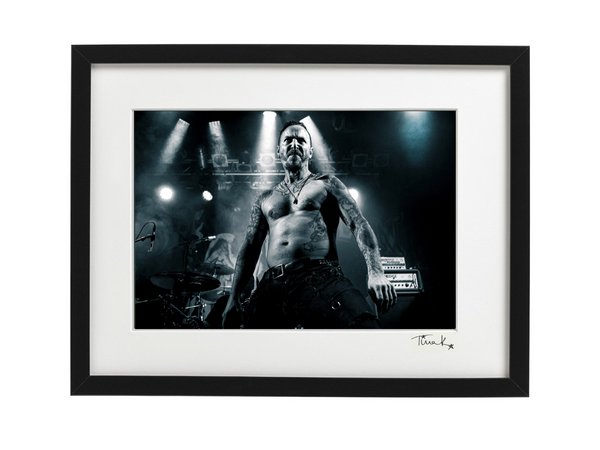 Framed print of Jeff JJ Janiak of Discharge on stage at the Electric Ballroom London, 2019. Black & white print, signed by Tina K Photography.