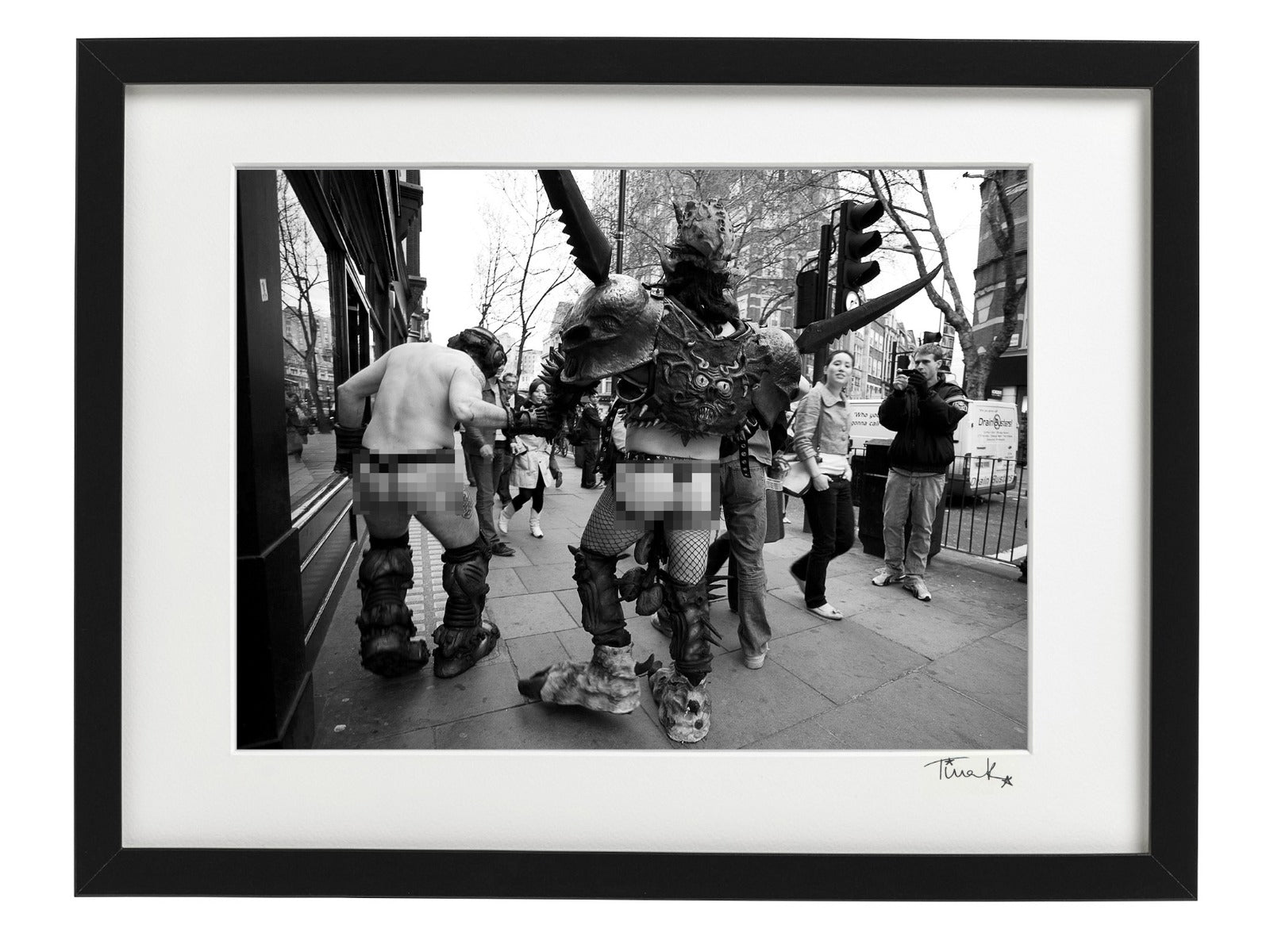 Oderus Urungus from GWAR making his way back to Astoria from Crobar in London in 2007 with onlookers staring. Black and white framed print signed by Tina K Photography.
