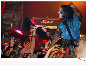 Joey Jordison (Slipknot, Murderdolls) crowdsurfing with his Gibson guitar at The Garage 2002. Print by Tina K Photography.