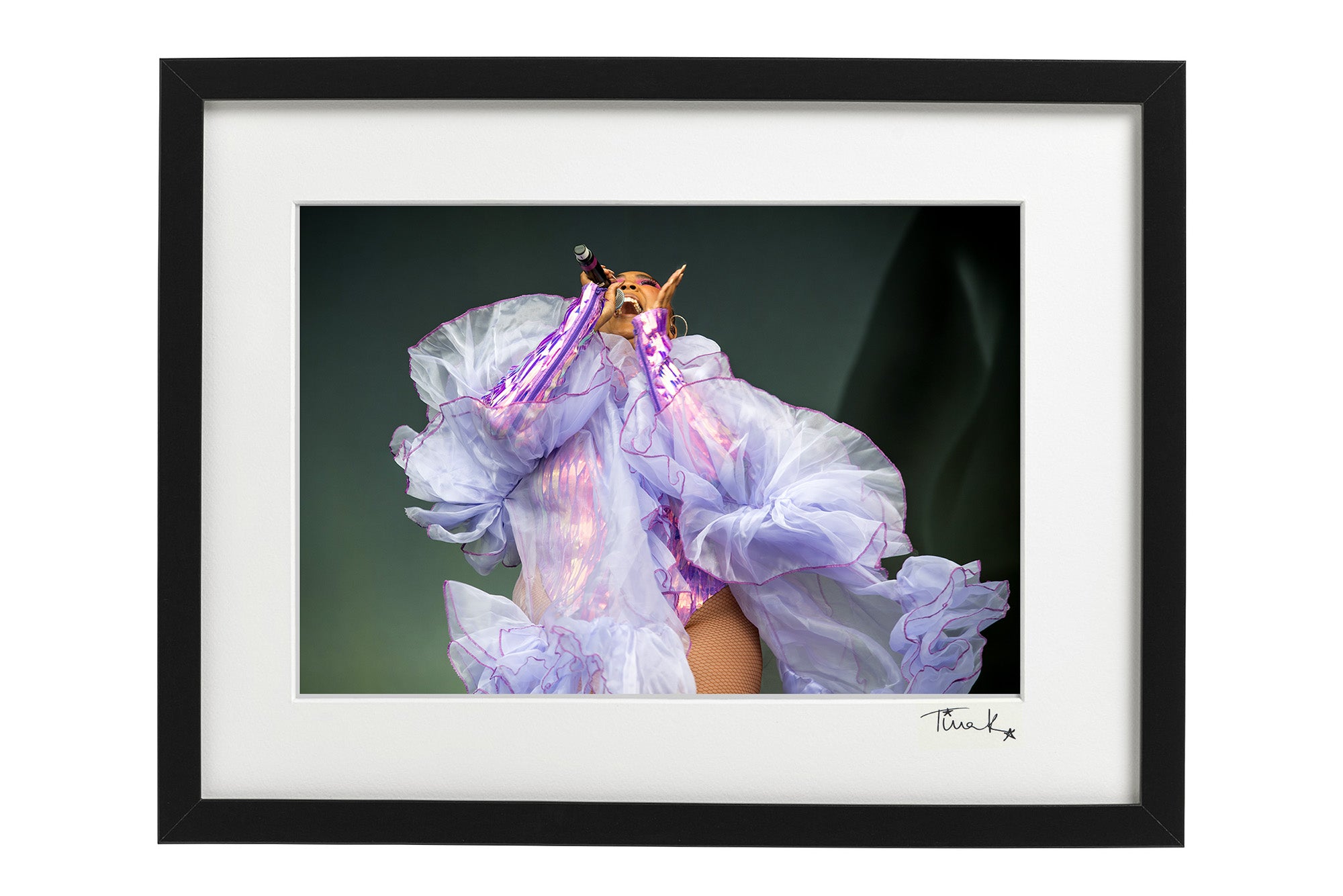 Framed print of Lizzo on stage at Glastonbury, 2019 in a metallic purple bodysuit and sheer scarf
