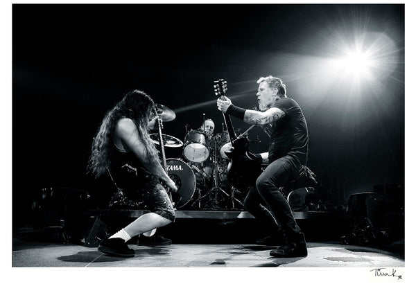 Black and white print of Robert, Lars and James of Metallica performing on stage 2009
