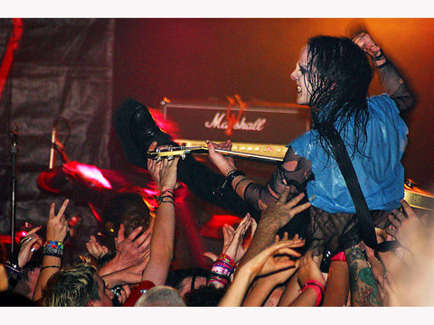 Joey Jordison (Slipknot, Murderdolls) crowdsurfing with his Gibson guitar at The Garage 2002. Print by Tina K Photography.