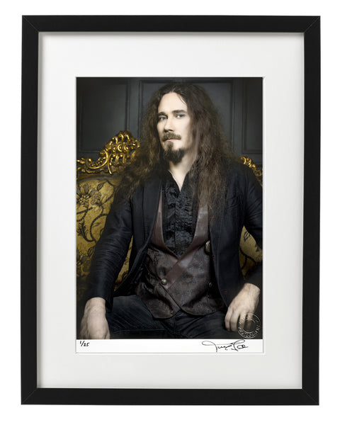 Framed Autographed print of Tuomas Holopainen of Finnish symphonic metal band Nightwish, sitting on elaborate gold sofa. Signed by the artist. Photo by Tina K Photography.