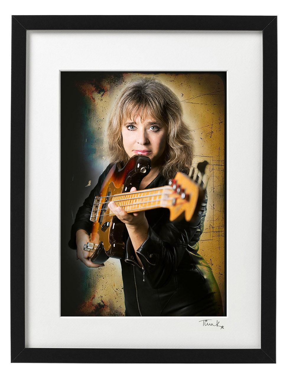 Poster print of rock singer and bassist Suzi Quatro in her leather jumpsuit or Tuscadero at her home in Essex in 2014.