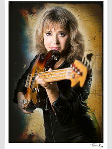 Poster print of rock singer and bassist Suzi Quatro in her leather jumpsuit, known from the Happy Days, at her home in Essex in 2014.