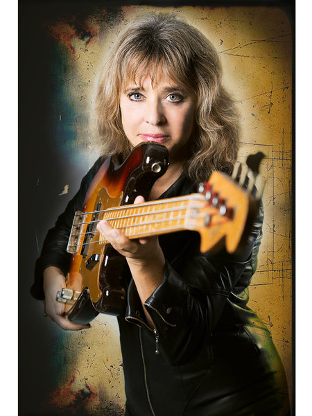 Poster print of rock singer and bassist Suzi Quatro in her leather jumpsuit her home in Essex in 2014.