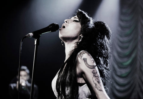 Print of singer Amy Winehouse, performing onstage at Shepherd's Bush Empire in 2007