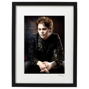 Framed Poster print of Ville Valo from Finnish rock band HIM sitting wearing a black jacket 2005