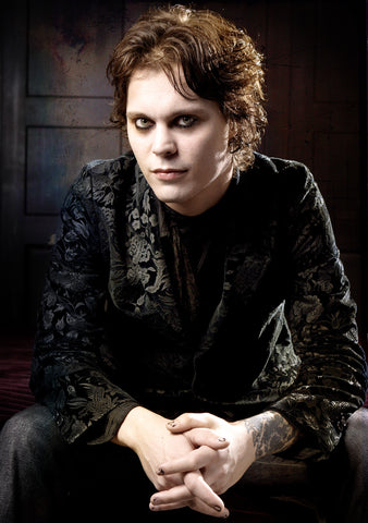 Poster print of Ville Valo from Finnish rock band HIM sitting wearing a black jacket 2005