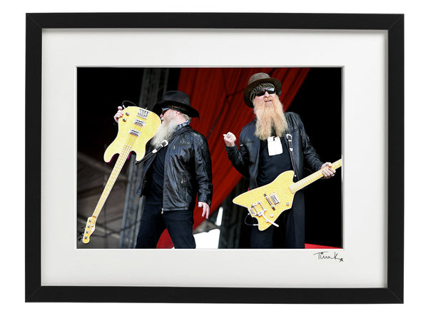 Dusty Hill and Billy Gibbons of ZZ Top with guitars, on stage at Download Festival 2009. Original framed print, signed by Tina K Photography.