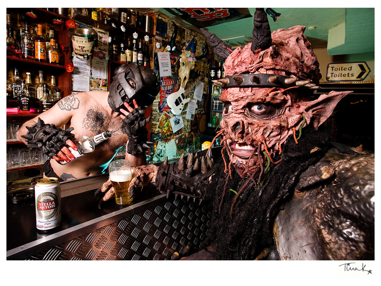 Oderus Urungus of GWAR holding a beer sitting at the bar in London's Crobar in 2008. Print by Tina K Photography.