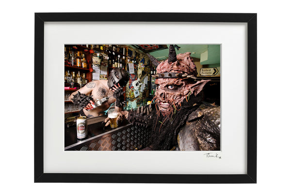 Oderus Urungus of GWAR holding a beer sitting at the bar in London's Crobar in 2008. Framed print by Tina K Photography.